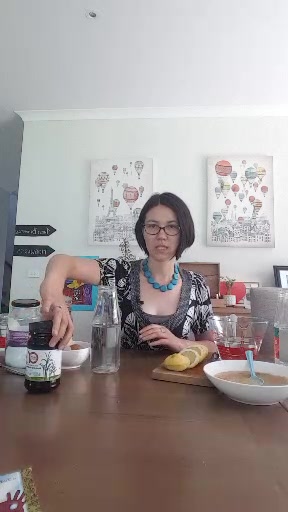 Lady at table making water kefir